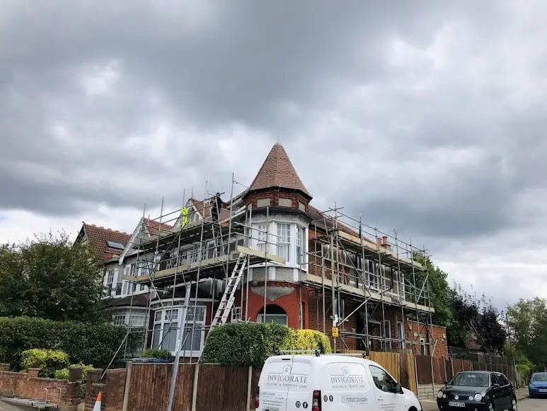 Large Victorian turreted property under full scaffold for a new roof