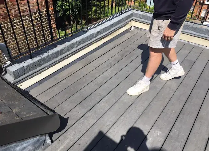 Roof terrace with new decking laid over a waterproofed roof surface